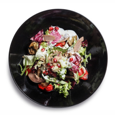 Теплий салат з телячим язиком/Warm salad with veal toungue, grilled eggplant, bell pepper, pumpkin, onion with salad mix, walnuts and pomegranate, seasoned with garlic yogurt and dressing