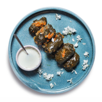Толма/Tolma-a traditional Caucasian dish of ground beef and rice wrapped in lowsalted grape leaves under yogurt sauce